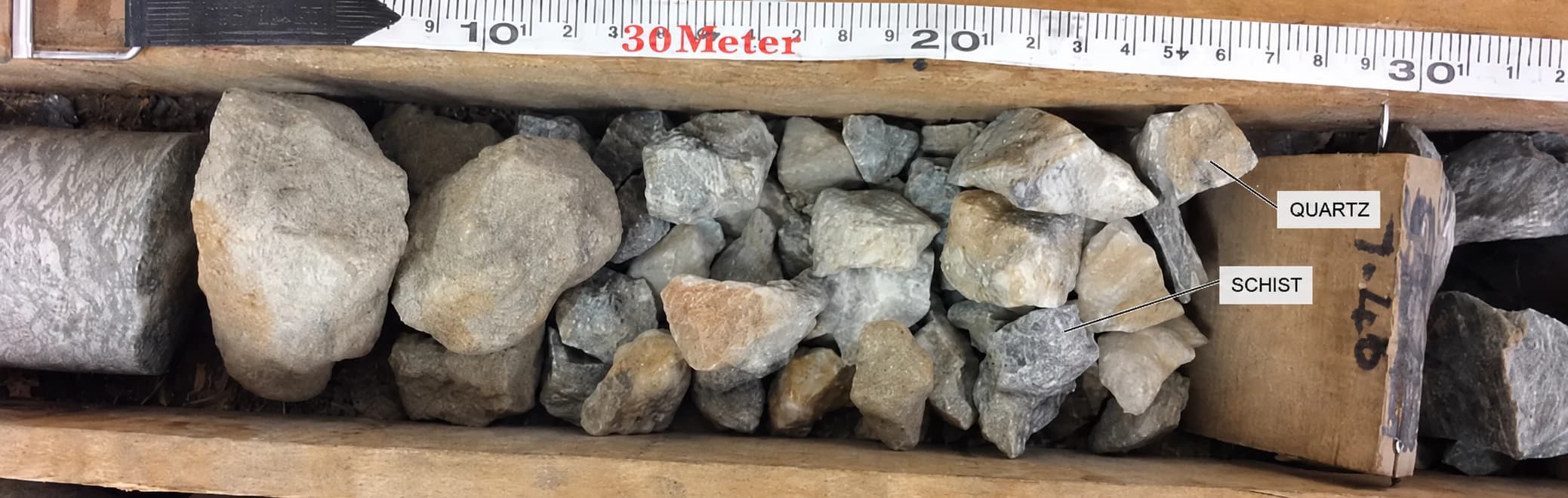 First broken drill-core zone containing labelled quartz and schist fragments.